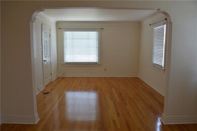 Living room with oak wood floors & archways