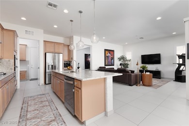 Kitchen featuring stainless steel appliances, a si