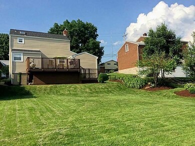 Exterior Back. Beautiful lage yard, storage shed, 