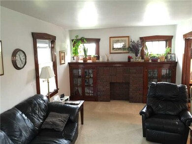 Living Room. view of the fireplace and built in bo