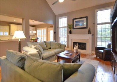 Great room . . .. open to kitchen and breakfast area . . . gorgeous back yard view . .  .