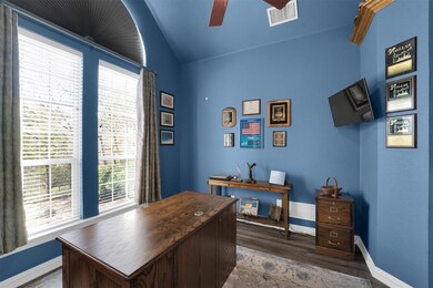 Office featuring ceiling fan, lofted ceiling, visi