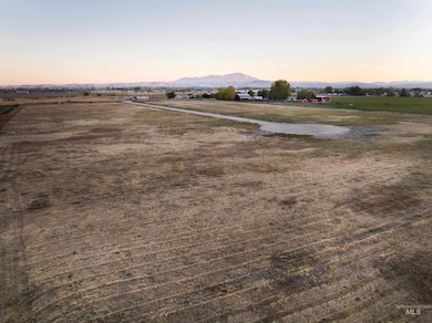 Aerial view at dusk of a mountain view and a view of rural / pastoral area