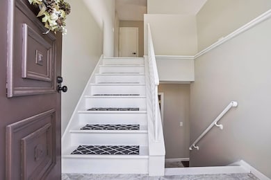 Front foyer with short steps to either level of home.
