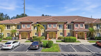 Mediterranean / spanish home with uncovered parking, stucco siding, and a tiled roof