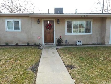Large front yard with sprinklers