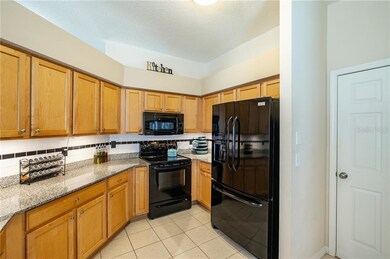 Kitchen has ample Granite Counter Space and Cabine