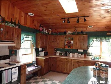 Kitchen. Skylight and lots of windows provide plen