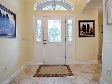 LOVELY FOYER WITH LEADED GLASS FRONT DOOR WITH SID
