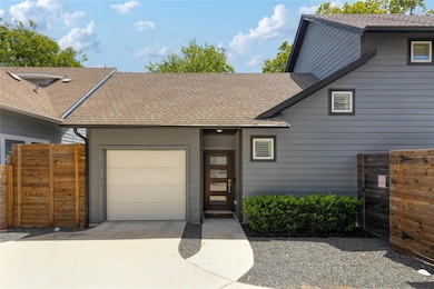 View of front facade featuring an attached garage