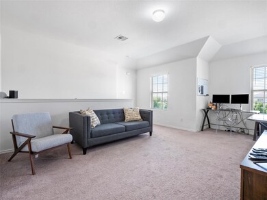 Living room with carpet flooring and baseboards