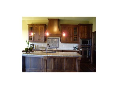Granite kitchen, built in wall ovens, upgraded fau