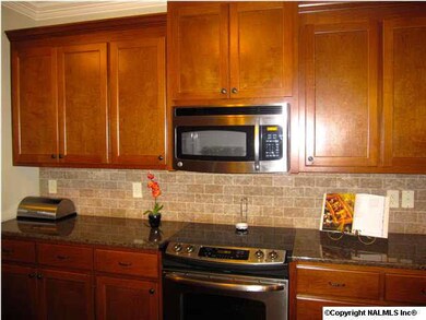This gorgeous backsplash compliments the stunning granite counters and the beautiful cabinets in this award winning kitchen!