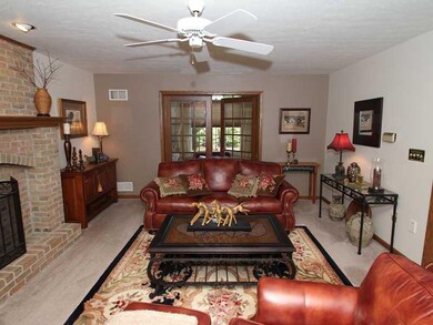 Family Room. Beautiful brick fireplace can be enjo