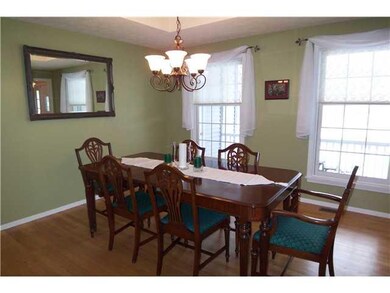 Dining Room Hardwood Floors, a Tray Ceiling, and N