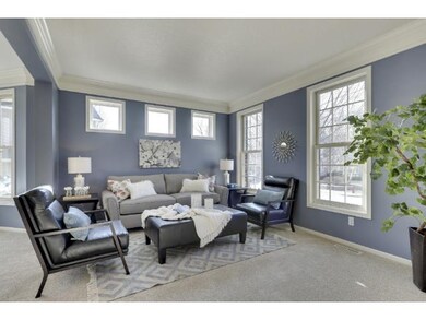 The formal living room boasts new carpeting, trans