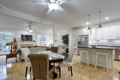 Dining area with ceiling fan, plenty of natural l