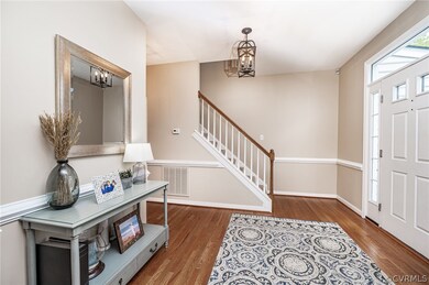 View of steps to upstairs from the foyer.