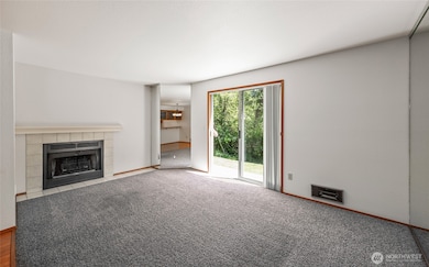 In the living room is a wood burning fireplace. The view is also spectacular.