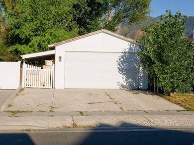 Detached garage featuring a mountain view