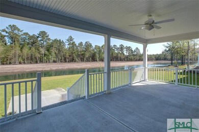 Exterior rear view with large covered porch and vi