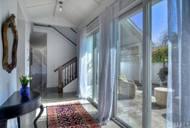 View of hallway showing walnut staircase and slidi