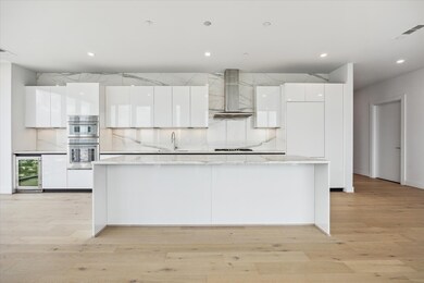 Chefs kitchen features Pedini cabinetry, porcelain