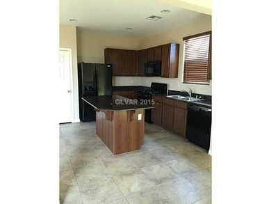 Kitchen. Large tile from kitchen into dinning room