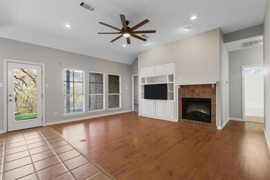 Unfurnished living room with built in shelves, cei