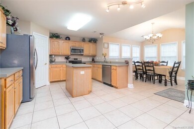 Large kitchen has plenty of storage and a pantry.