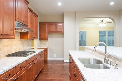 Another view of the kitchen and STAINLESS STEEL APPLIANCES!