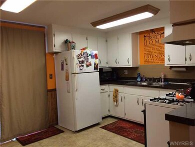 Kitchen. Glass Sliding door off kitchen lead to de