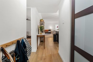 Hall featuring light wood-style flooring