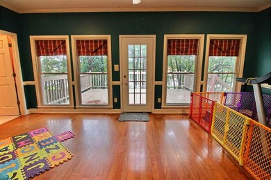 Spacious bonus room with hardwood floors and direc