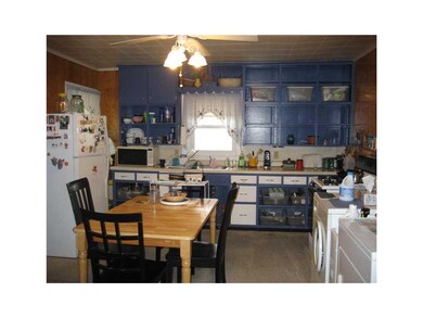 Kitchen. A wall of cabinets and an eat-in kitchen
