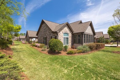 The landscaped berm in the back of the home makes for pretty views and added privacy