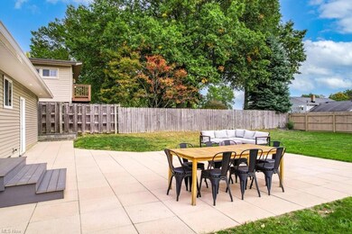 View of patio with an outdoor hangout area