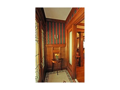 Panelled vestibule with exquisite tiled floor.