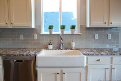 Farmhouse sink and upgraded granite coun