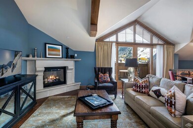 Main living room with a fireplace and va