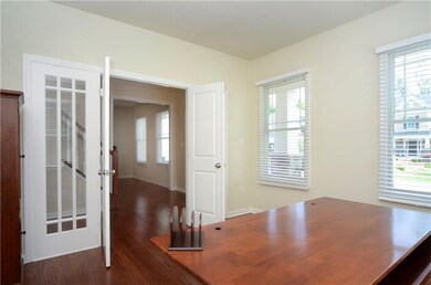 Study features French doors with side lights. Cust