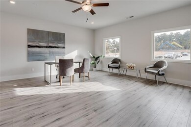 Dining area featuring an office area, light wood-style flooring, recessed lighting, and ceiling fan
