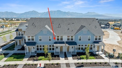 View of front of property with a mountain view, roof with shingles, and covered porch