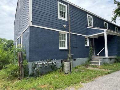 View of side of property with central air conditio