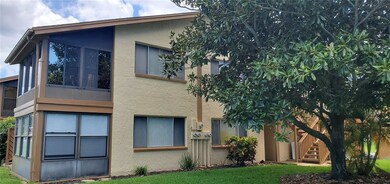 Side view of unit.  Mature landscaping.