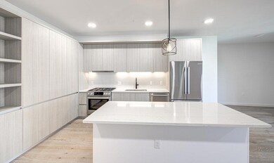 Kitchen featuring stainless steel appliances, mod