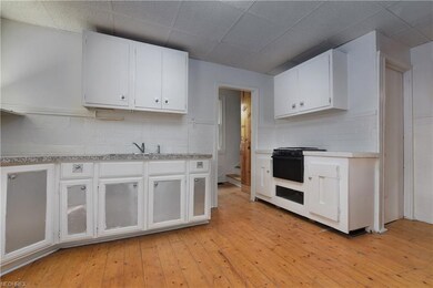 Additional view of down kitchen.