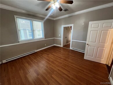 Empty room with ornamental molding, ceiling fan, a