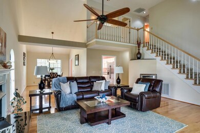 The open staircase and upper level landing provide the airy feel to the home.