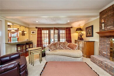 Warm and cozy living space with French doors, crow